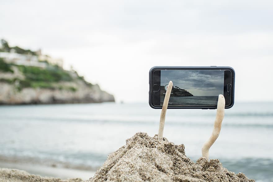ビーチ、砂、カメラ、携帯電話、三脚