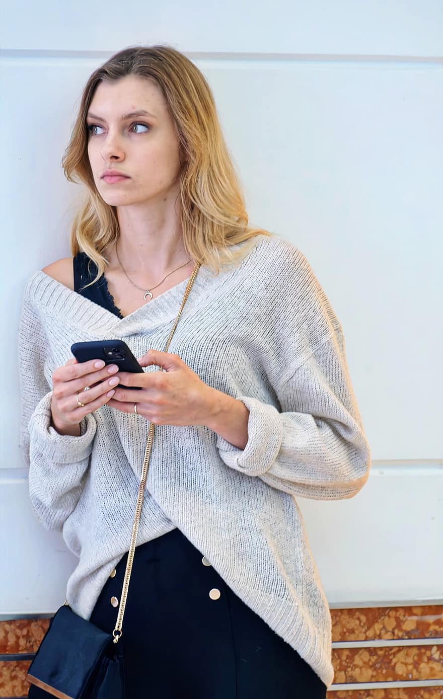 Woman, Leaning Against A Wall, Smartphone, Mall, Blonde, women, one person, adult, young adult, lifestyles, mobile phone