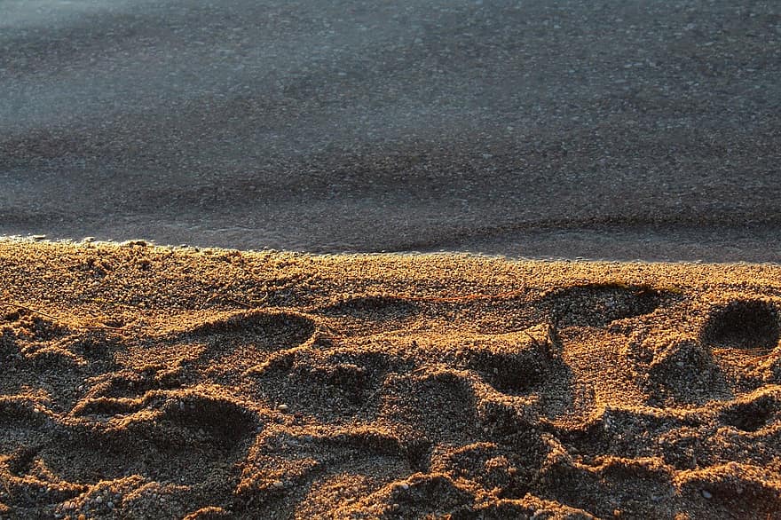 Strand, sand, solnedgang