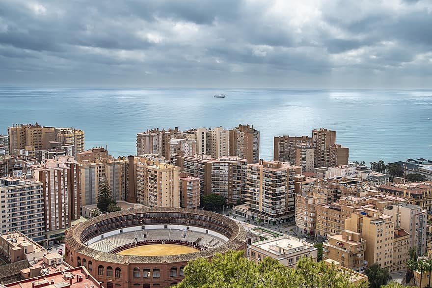 City, Buildings, Sea, Bullring, Malaga, Spain, Coast, Landscape, Horizon, Sky, Clouds
