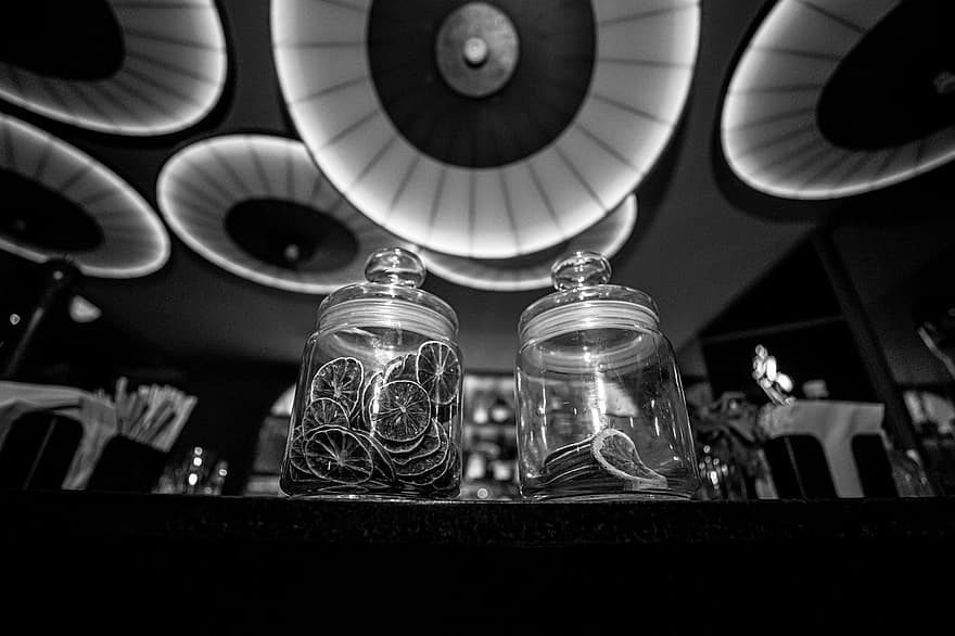 Container, Monochrome, Jar, Dried Fruits, close-up, black and white, currency, indoors, table, stack, glass