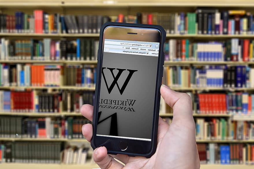 wikipedia, książki, encyklopedia, tematy, dłoń, iPhone, trzymać, biblioteka, książka, czytać, półka