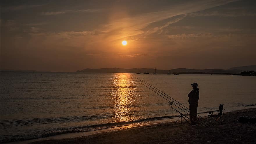 رجل ، صياد السمك ، البحر ، غروب الشمس ، محيط ، ماء ، طبيعة ، سماء ، شاطئ بحر ، شروق الشمس